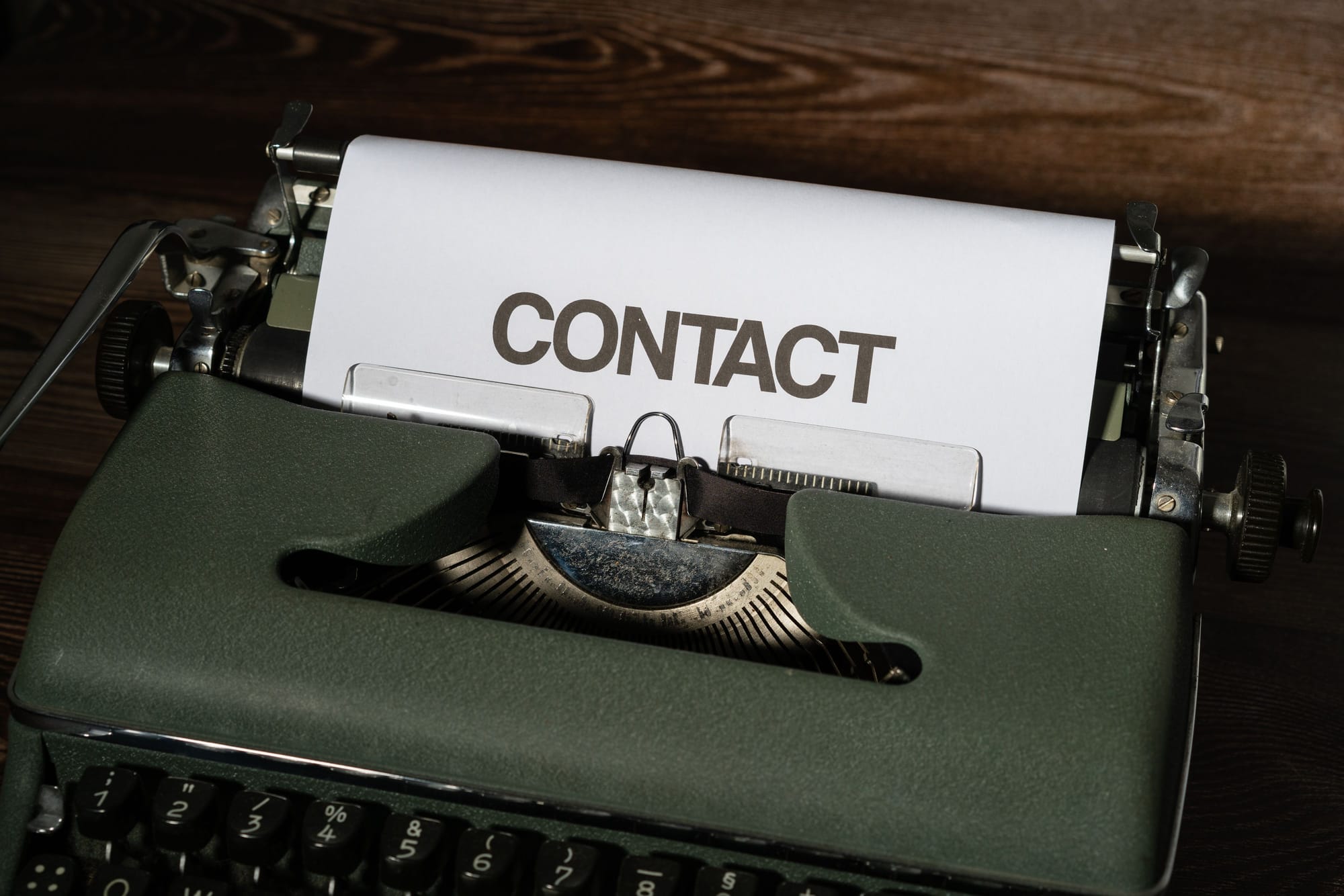 Typewriter with the word contact on paper